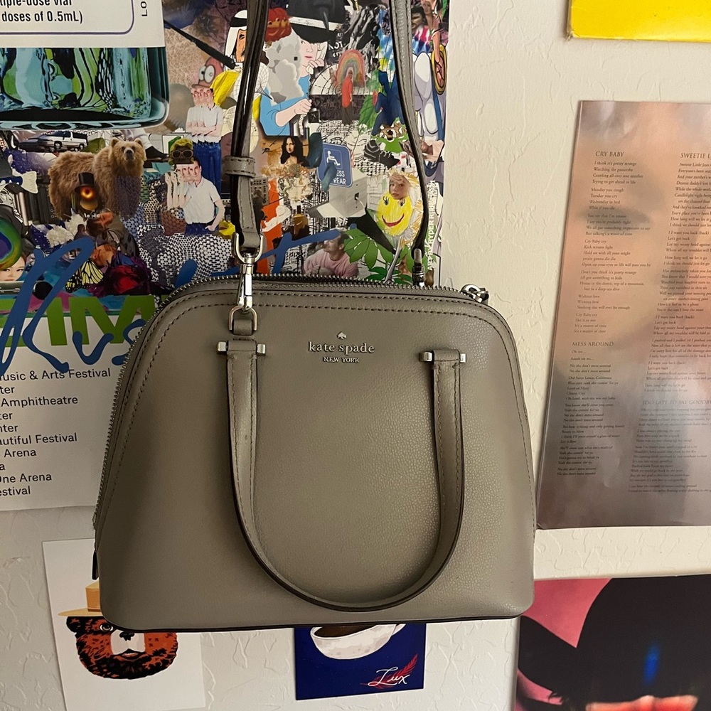 Grey Kate Spade bag with removable strap